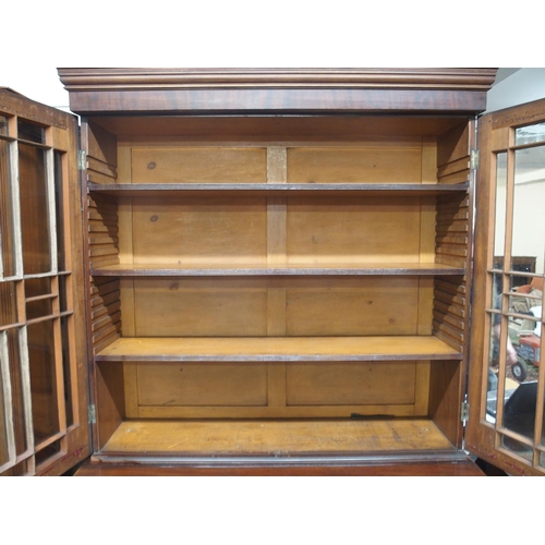 36 - A Victorian astragal glazed bookcase with moulded cornice over pair of astragal glazed doors on cabi... 