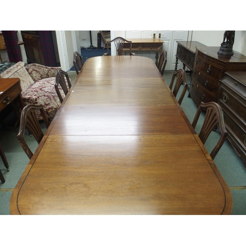 41 - A large 20th century mahogany triple pedestal dining table and eight chairs, table 73cm high x 323cm... 