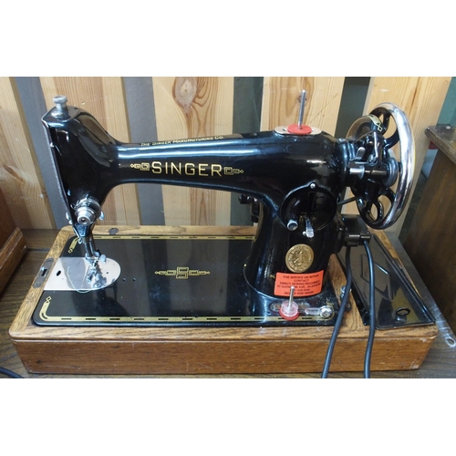 63 - A mixed lot to include cased Singer sewing machine, brass and marble based table lamp and two wall m... 