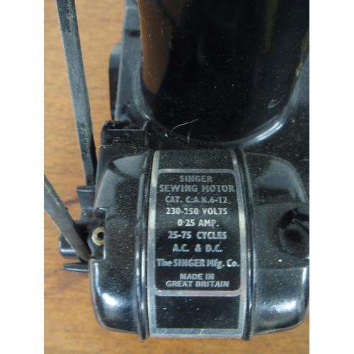 70 - A Singer 221 Featherweight sewing machine serial number EG642200 (lacking case, leads etc) and a Sin... 