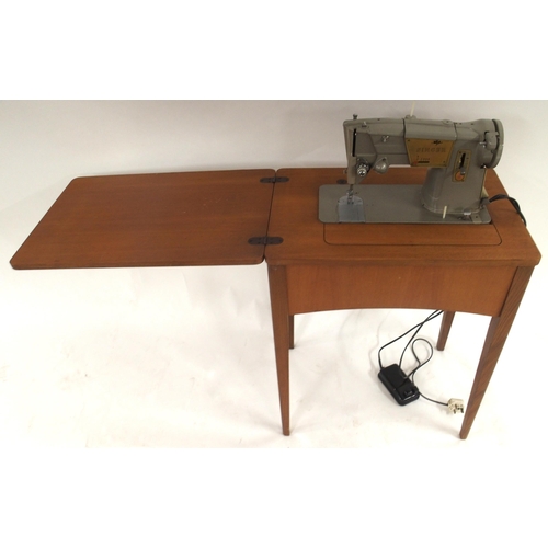 70 - A Singer 221 Featherweight sewing machine serial number EG642200 (lacking case, leads etc) and a Sin... 