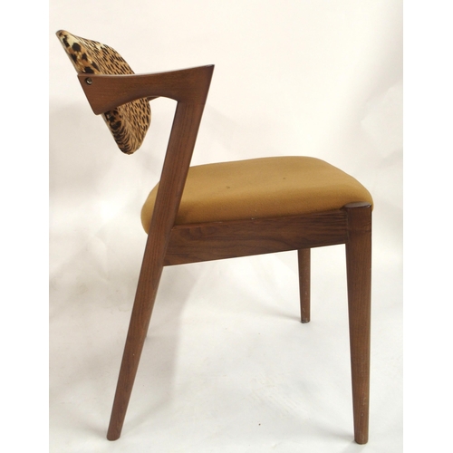 73 - A lot of four mid 20th century teak framed Kai Kristiansen model 42 dining chairs with distinctive s... 