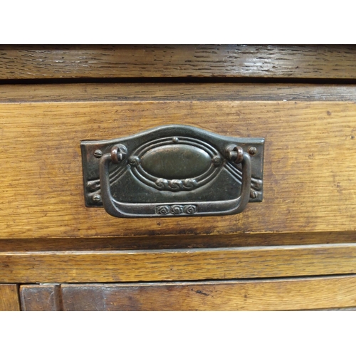 82 - A 20th century oak art nouveau sideboard, 148cm high x 138cm wide x 50cm deep