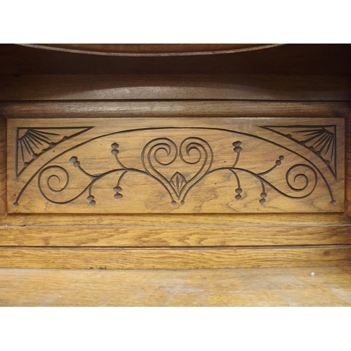 82 - A 20th century oak art nouveau sideboard, 148cm high x 138cm wide x 50cm deep