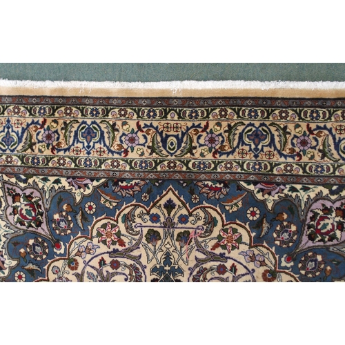 94 - A CREAM GROUND MESHED RUGwith blue starburst central medallion, matching spandrels and floral multic... 