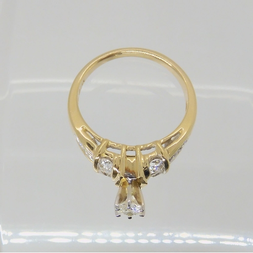 692 - A 14k gold diamond ring, the central high prong set diamond is estimated approximately at 0.20cts wi... 