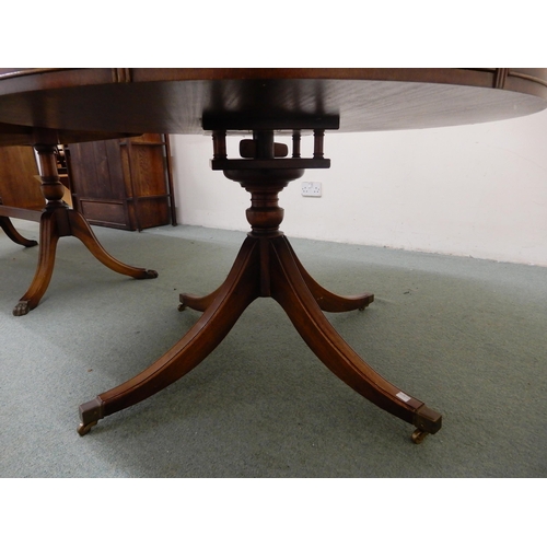 104 - A 20th century mahogany drum table with leather skiver top over four drawers on quadrupedal base, 75... 