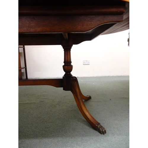 104 - A 20th century mahogany drum table with leather skiver top over four drawers on quadrupedal base, 75... 