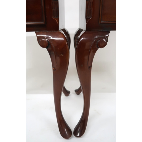 18 - A pair of 20th century mahogany two drawer bedside tables on cabriole supports, 68cm high x 52cm wid...