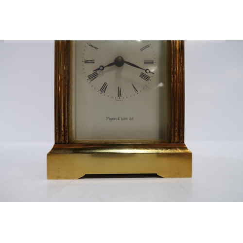 233 - A Mappin and Webb brass and glass carriage clock, with key