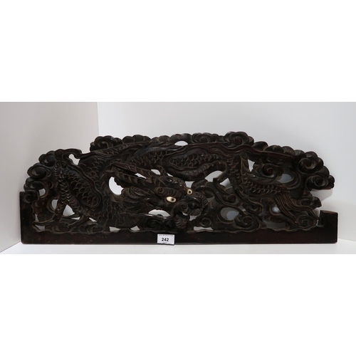 242 - A pair of carved wooden dragon panels