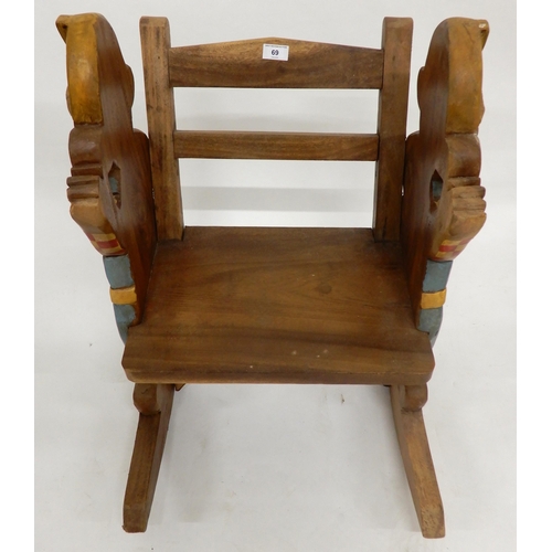 69 - A contemporary Moulin Roty child's pull cart and a contemporary child's rocking chair with carved an... 