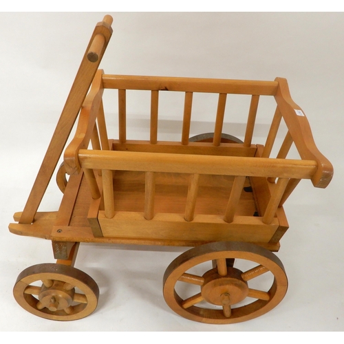 69 - A contemporary Moulin Roty child's pull cart and a contemporary child's rocking chair with carved an... 