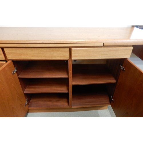 78 - A mid 20th century Danish teak Gangso Mobler sideboard with tile inset slide over three drawers over... 