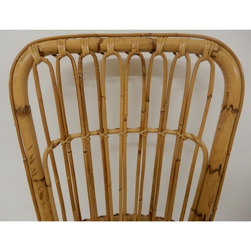 87 - A 20th century bamboo rocking chair, 111cm high x 57cm wide x 89cm deep