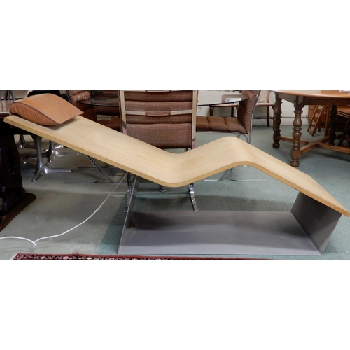 88 - A contemporary teak Porcelanosa system pool heated lounger with leather head rest, 83cm high x 183cm... 