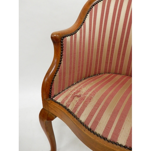 91 - A 20th century mahogany framed tub chair on cabriole supports and accompanying footstool both uphols... 