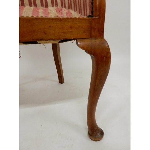 91 - A 20th century mahogany framed tub chair on cabriole supports and accompanying footstool both uphols... 