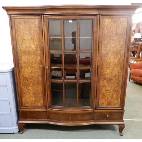 96 - An early 20th century mahogany bookcase with central bowed glazed door flanked by walnut veneered ca... 