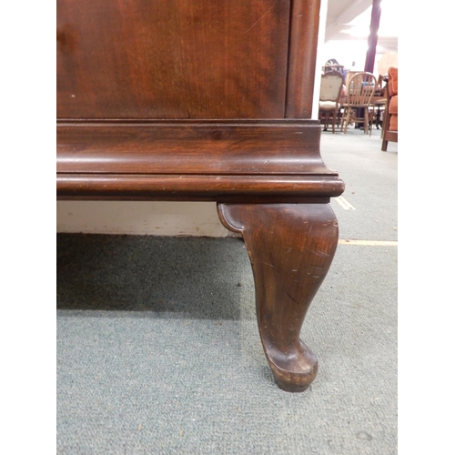 96 - An early 20th century mahogany bookcase with central bowed glazed door flanked by walnut veneered ca... 