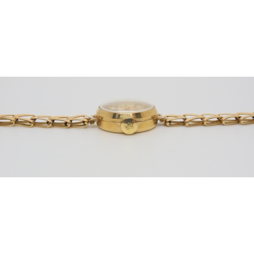 645 - A 9ct gold ladies Marvin watch and strap, weight together with mechanism 13.1gms...