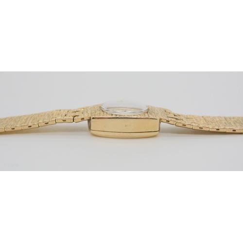 653 - A 9ct gold Jaquet Droz retro wristwatch with all over texture, length 17cm, weight including mechani...