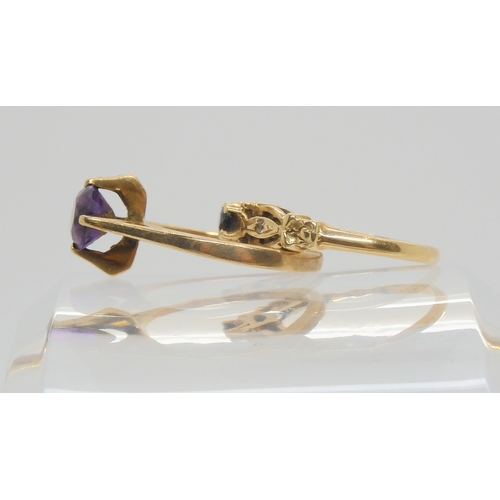 678 - A 9ct gold retro amethyst ring, size P, weight 3.1gms, and a 14ct gold sapphire and clear gem ring, ... 