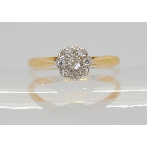 688 - An 18ct gold old cut diamond flower ring, set with estimated approx 0.10cts of old cut diamonds, fin... 