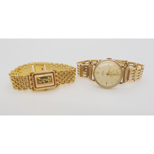 697 - A 9ct gold cased Smiths De Luxe gents watch with a rolled gold strap, weight including strap and mec... 