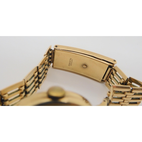 697 - A 9ct gold cased Smiths De Luxe gents watch with a rolled gold strap, weight including strap and mec... 