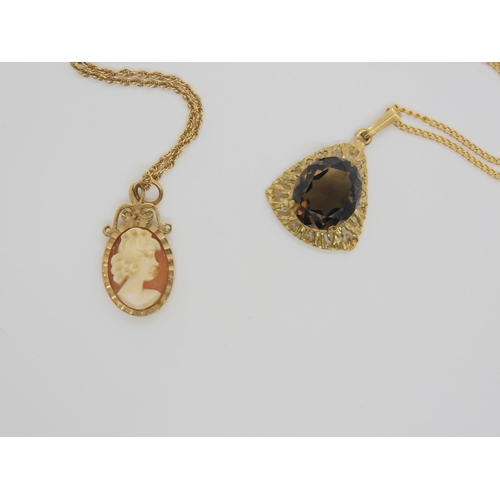 698 - A 9ct gold retro smoky quartz pendant with a 46cm 9ct chain, a 9ct cameo pendant with a 41cm 9ct rop... 