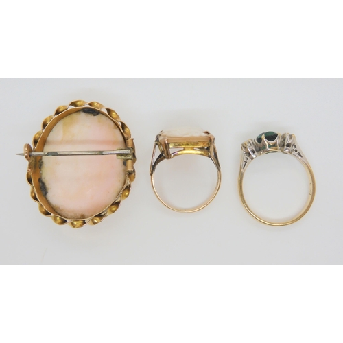 705 - A yellow metal mounted cameo ring and brooch, together with a gem set ring, weight together 13.4gms