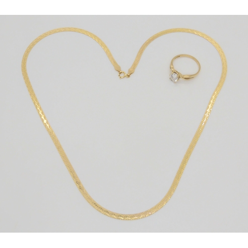 706 - A 9ct gold Italian made ribbon chain, length 46cm, and a cz set ring, size O weight together 6.8gms