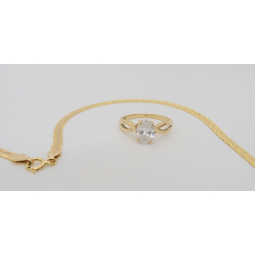 706 - A 9ct gold Italian made ribbon chain, length 46cm, and a cz set ring, size O weight together 6.8gms