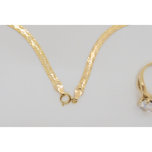 706 - A 9ct gold Italian made ribbon chain, length 46cm, and a cz set ring, size O weight together 6.8gms