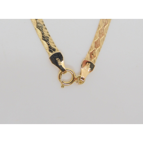 706 - A 9ct gold Italian made ribbon chain, length 46cm, and a cz set ring, size O weight together 6.8gms