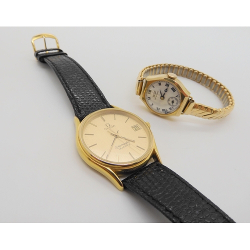 707 - A gold plated Omega Seamaster quartz, together with a 9ct gold ladies vintage Tissot watch with gold... 