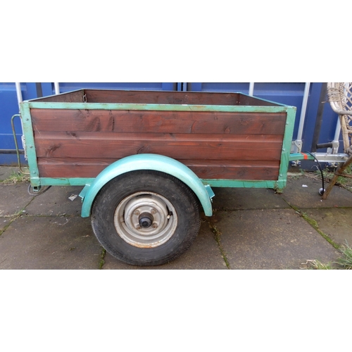 69A - A wood panelled side single axle car trailer with hinged tailgate with mounted lights and spare whee... 