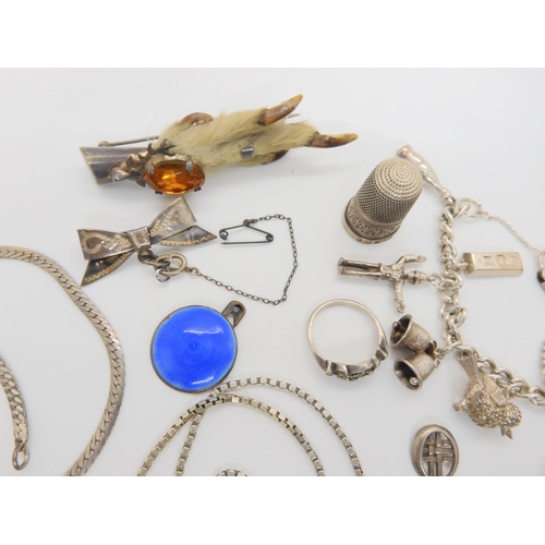 732 - A Robert Allison banded agate brooch, a silver mounted grouse foot brooch, silver charm bracelet and... 