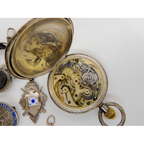 734 - A silver cased pocket watch with stop watch facility, bearing import marks for 1919, silver medallio... 