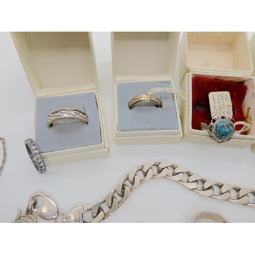 737 - a collection of silver rings in their original boxes from The Gem Box, Oban, silver chains and other... 