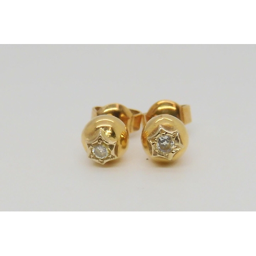 738 - A pair of 18ct gold diamond stud earrings of estimated approx 0.06cts, together with a carved mother... 