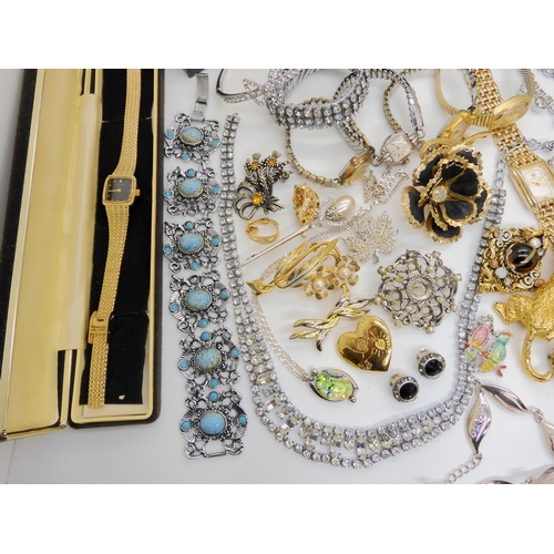 750A - A large collection of vintage costume jewellery to include a 9ct gold opal pendant (Weight 1gm) on a... 