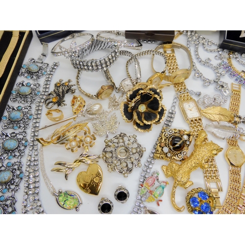 750A - A large collection of vintage costume jewellery to include a 9ct gold opal pendant (Weight 1gm) on a... 