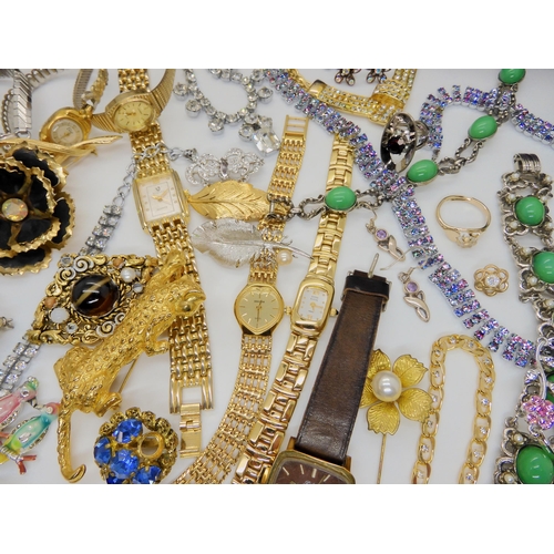 750A - A large collection of vintage costume jewellery to include a 9ct gold opal pendant (Weight 1gm) on a... 