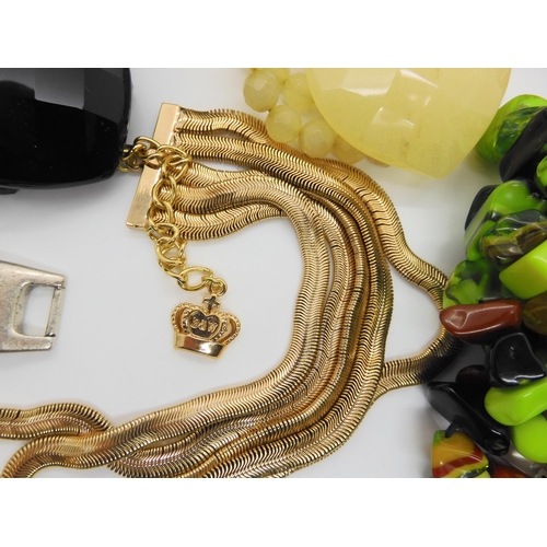 766 - A signed Sobral bracelet, a further unsigned example, a Butler & Wilson multi strand necklace, i... 