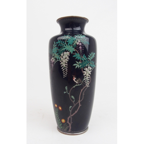 2362 - A JAPANESE CLOISONNE BALUSTER VASE decorated with a bird amongst wisteria branches and above flowers... 