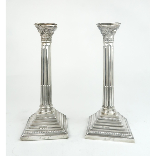 2461 - A PAIR OF GEORGE V SILVER CANDLESTICKSby Fattorini & Sons, Birmingham 1923, modelled as Corinthi... 