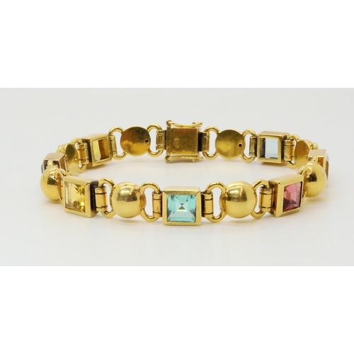 2709 - AN 18CT GOLD MIXED GEM SET BRACELETto include peridot, amethyst and aquamarine, length 18cm, weight ... 