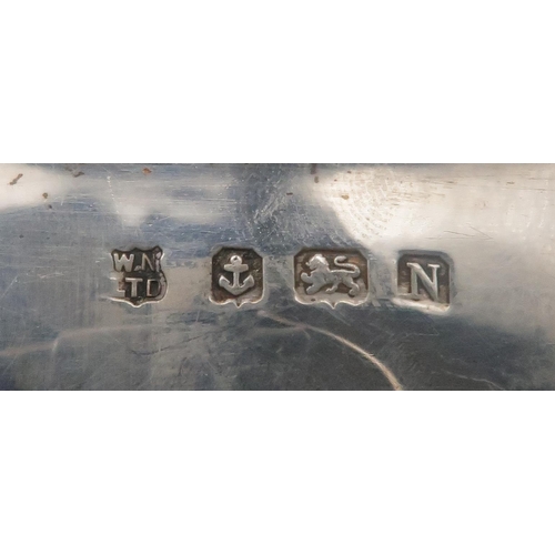 279 - An Art Deco three piece silver tea service, monogrammed 'K', by William Neale Ltd, Birmingham 1937, ... 